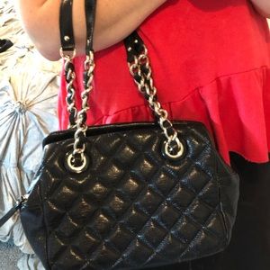Black Kate spade purse with metal and leather